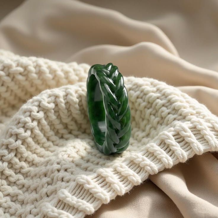 Real jade braided-style bracelet on white wool