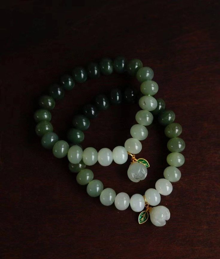 two real jade lotus bracelets
