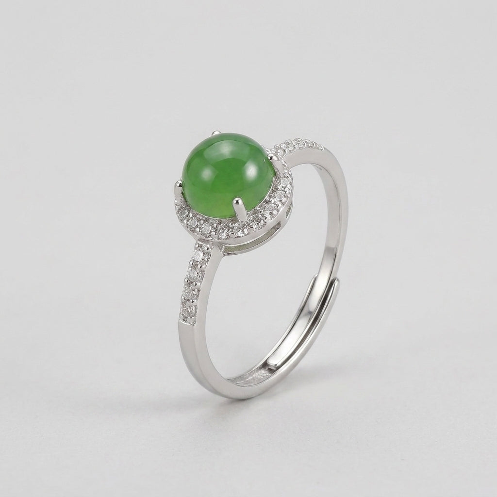 Answered - Green Jade Solitaire Ring with a halo of small clear stones on a silver band