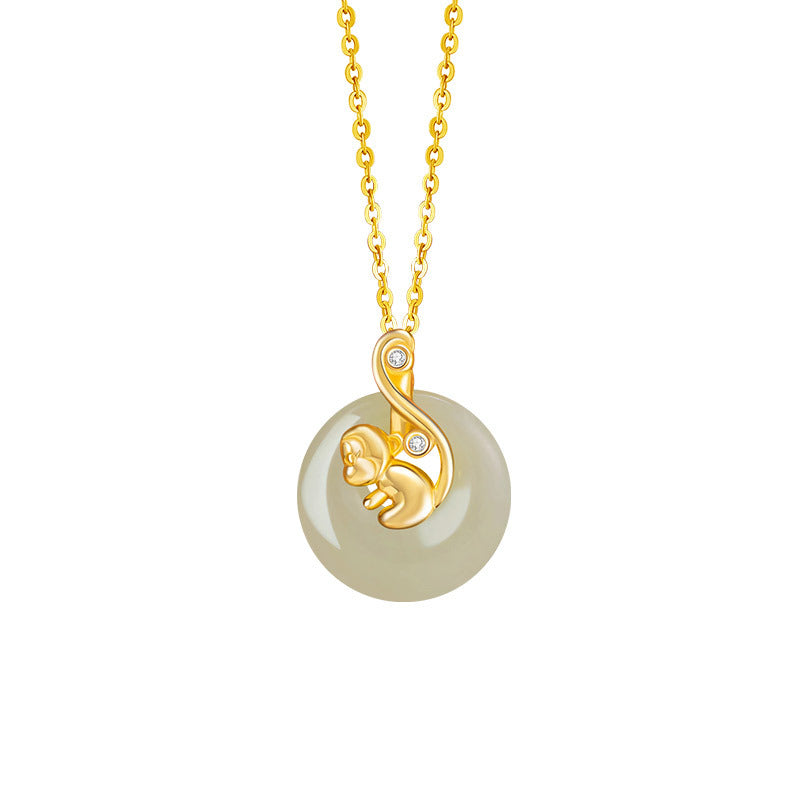 Birthright Hetian Jade Zodiac Pendant Necklace featuring a golden monkey charm with diamond accents on a circular jade pendant suspended from a delicate gold chain.