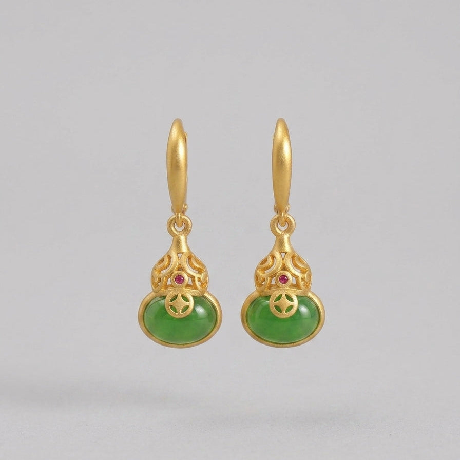Brimful Gourd Drop Earrings featuring polished green jade cabochons and small red accent stones, set in gold-tone metal with intricate filigree details.