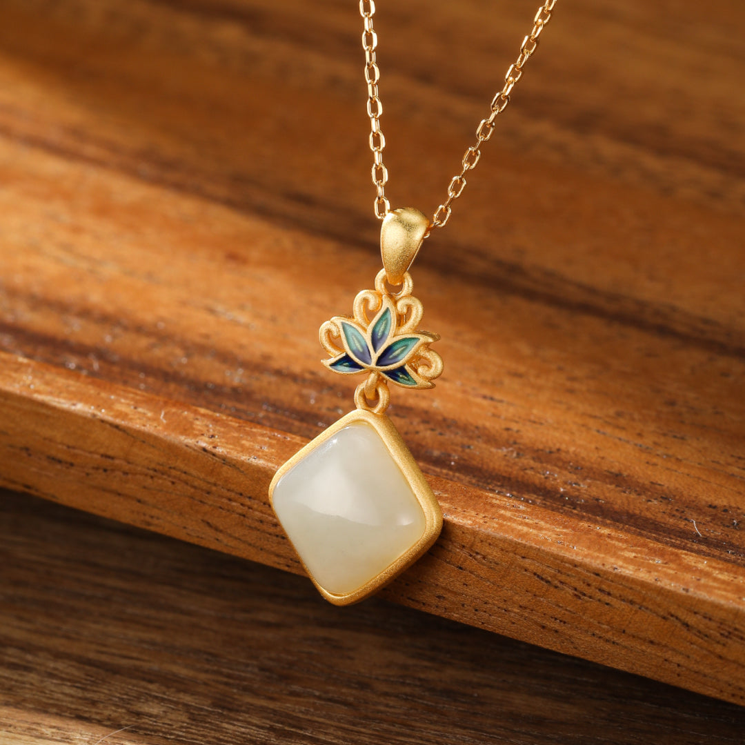 Ease Hetian Jade Lotus Pendant Necklace with a light green jade stone and blue lotus design on a gold chain.