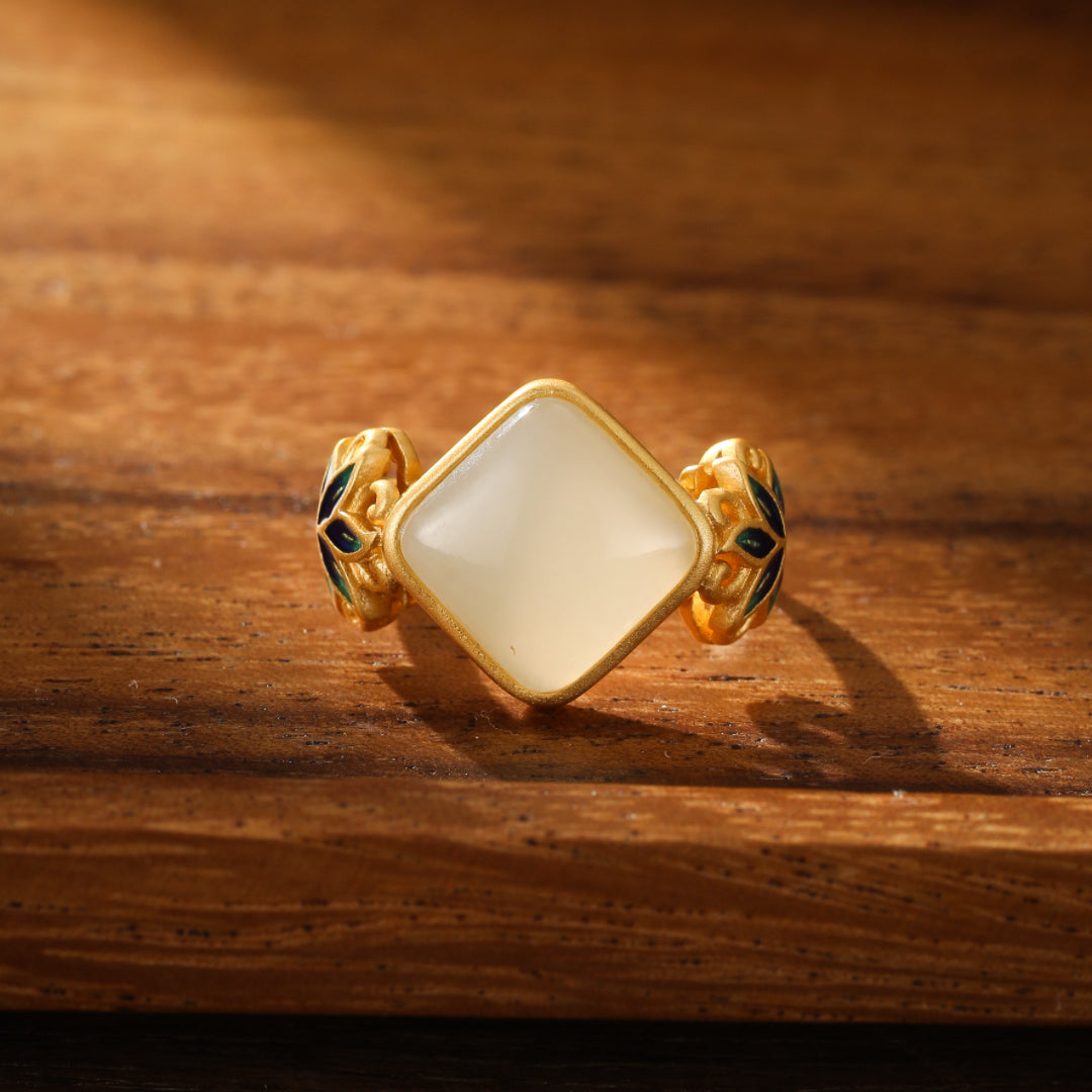 Ease Hetian Jade Lotus Ring with a square white jade centerpiece and gold-plated silver band with blue lotus accents