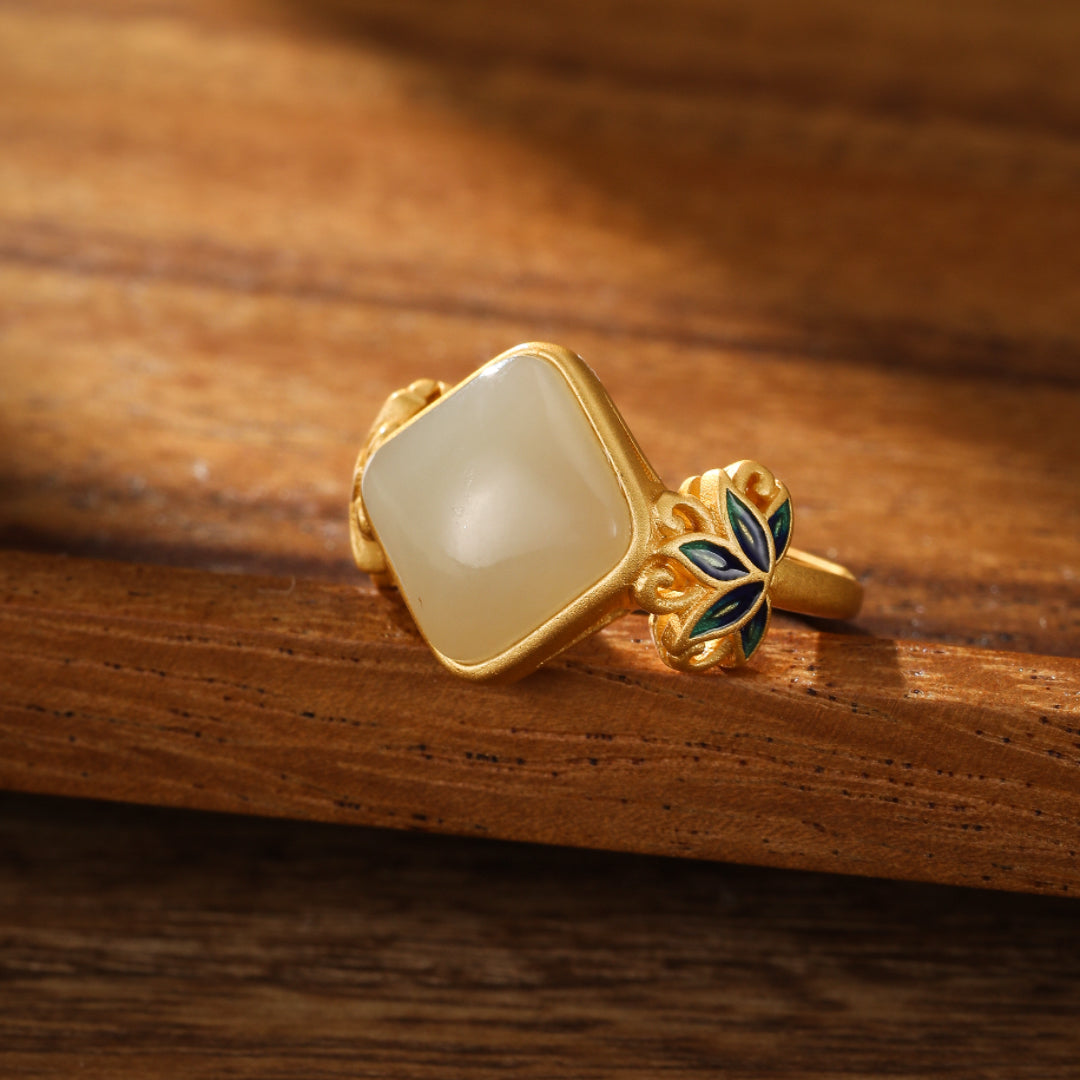 Ease Hetian Jade Lotus Ring with a square-cut white jade stone and blue and green enamel lotus accents on a gold-plated silver band.