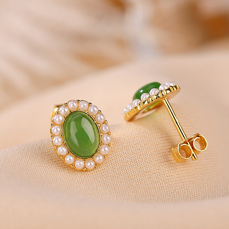 First Light green jade sun stud earrings with a halo of small pearls set in gold-plated silver