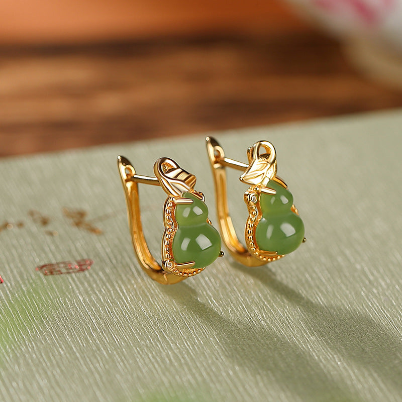 Harvest Green Jade Gourd Hoop Earrings with gold accents and a leaf detail.