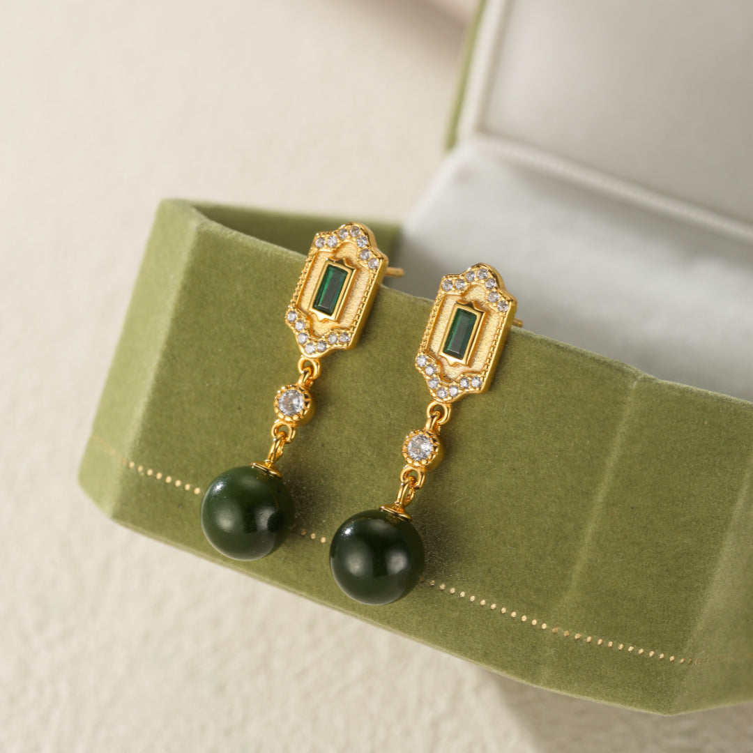 Kindred green jade and emerald drop earrings with gold accents and cubic zirconia.