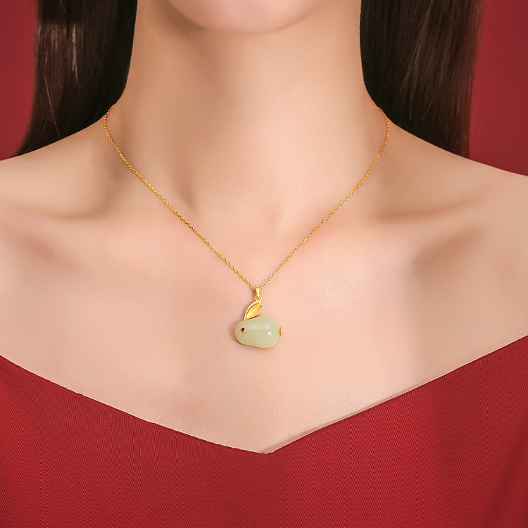 Moonglow Hetian Jade Rabbit Pendant Necklace with a gold-plated silver chain