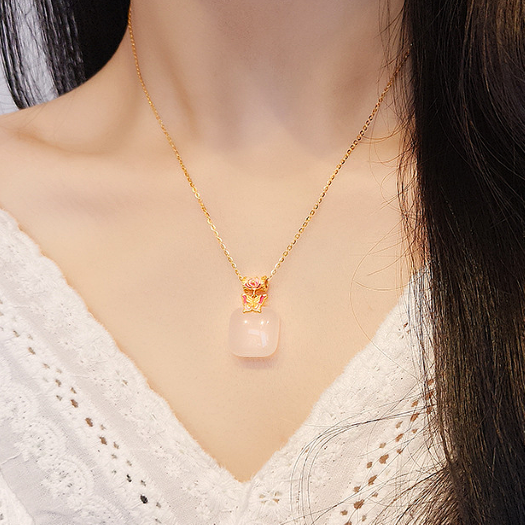 Second Act Mutton Fat Jade Butterfly Pendant Necklace with a soft pink jade square pendant and delicate gold chain.