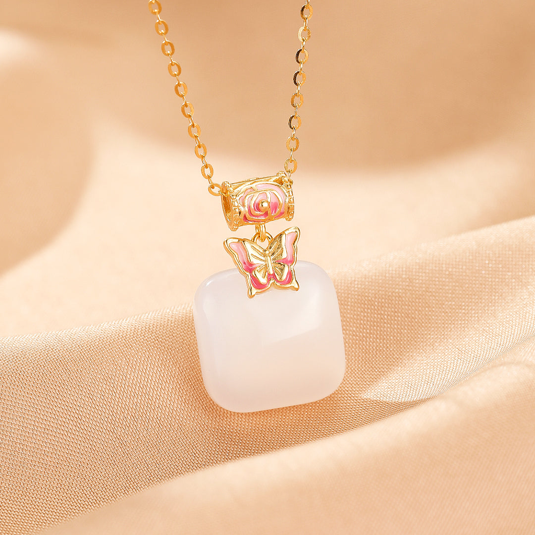 Second Act Mutton Fat Jade Butterfly Pendant Necklace with gold chain and pink enamel butterfly detail