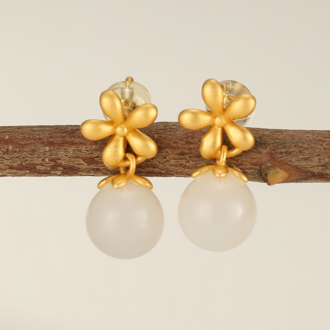 Sweet Nothings gold plated silver earrings with Hetian jade flower drop design