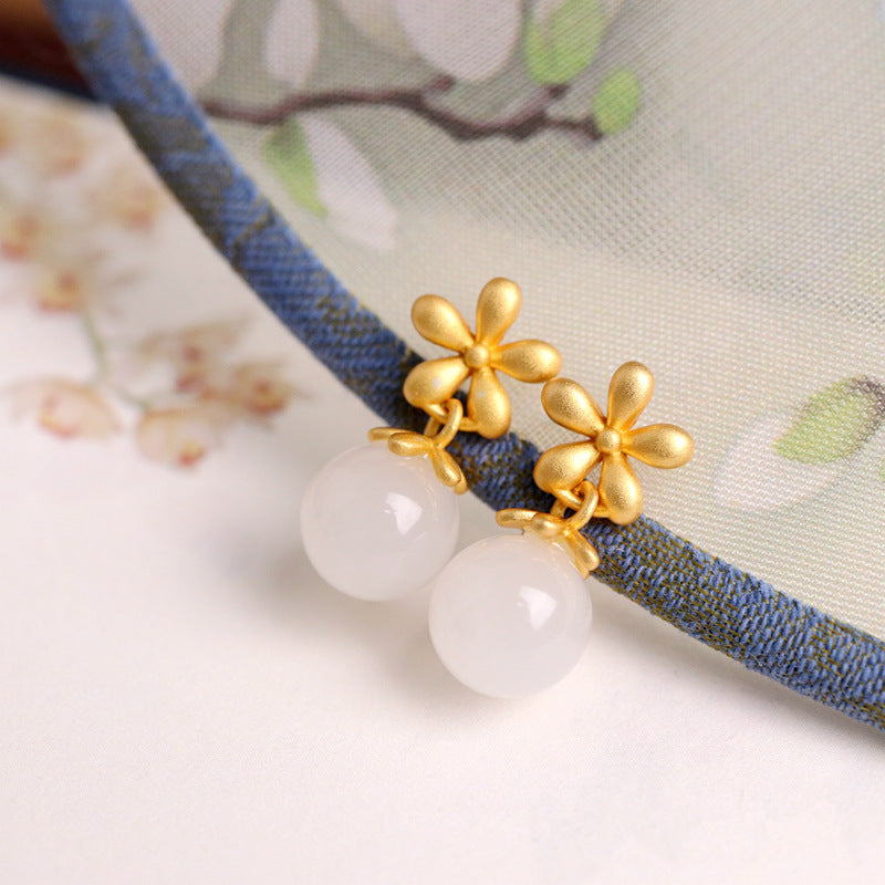 Sweet Nothings Hetian Jade Flower Drop Earrings with gold-plated silver and white jade beads.