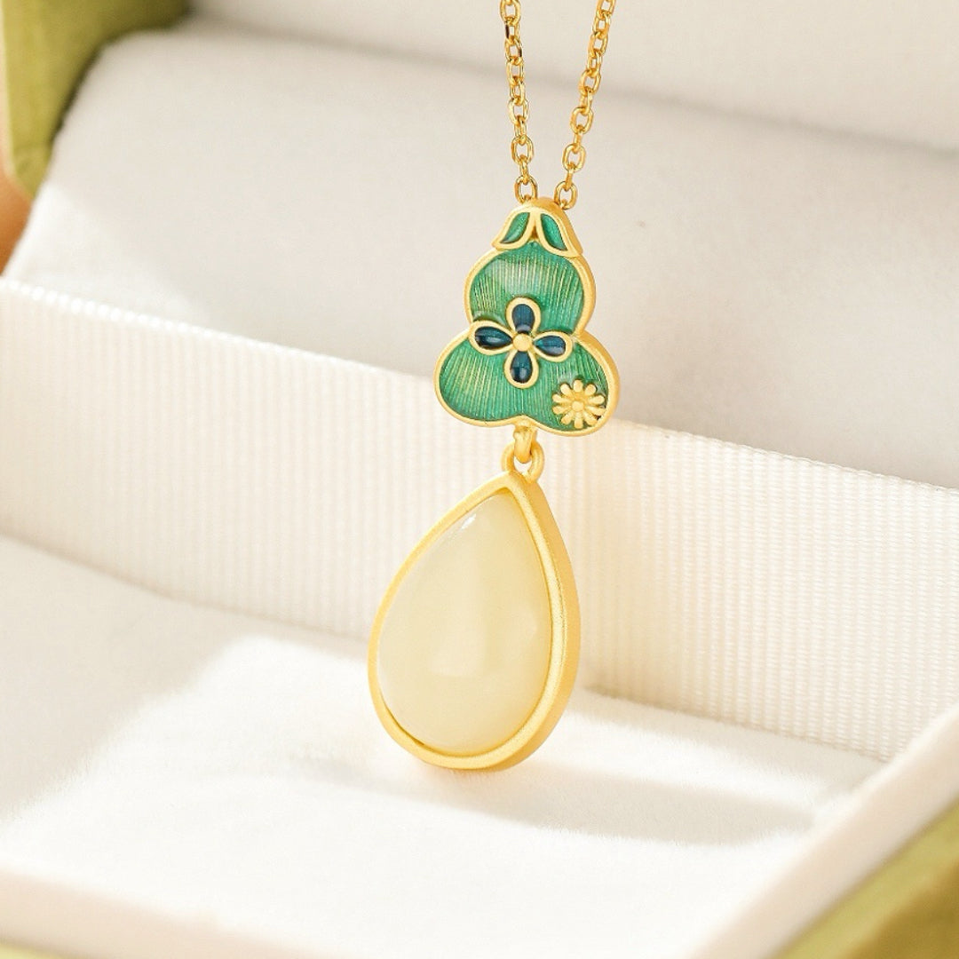 Twice Blessed Hetian Jade Gourd Jewelry Set with a gold-plated silver chain and a teardrop-shaped jade pendant.