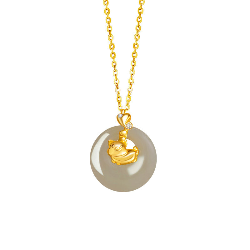 Gold pig charm with diamond accents on a round Hetian jade pendant necklace