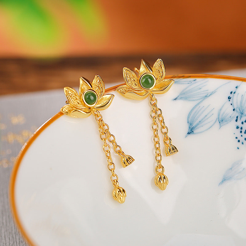 Evensong green jade lotus drop earrings with gold-plated chains and lotus bud accents.