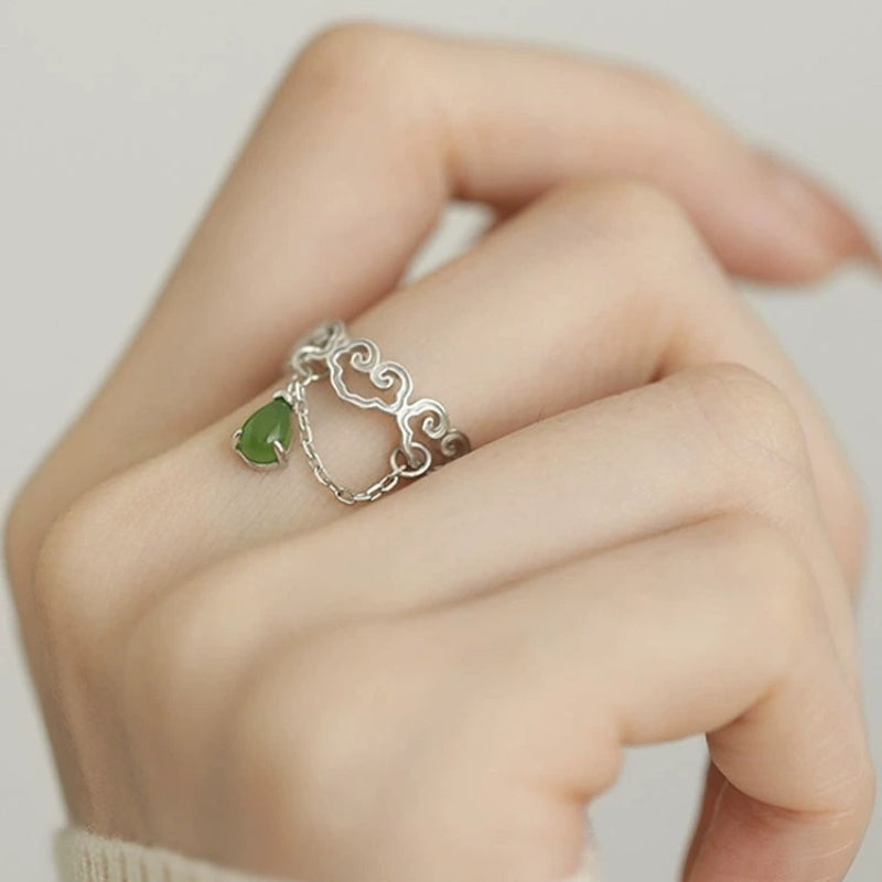 Heaven's Favor - Hetian Jade Cloud Ring with a teardrop jade charm and silver chain detail on a finger