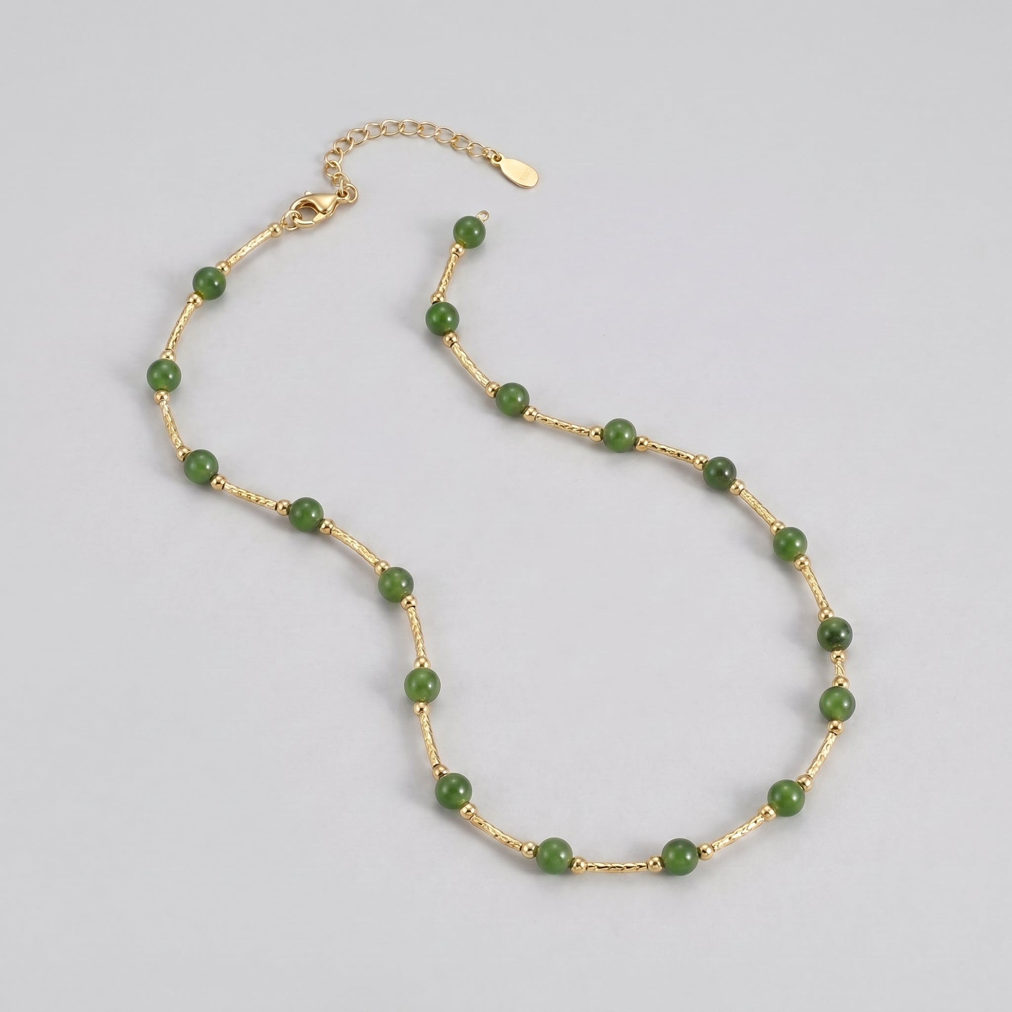 Heyday Green Jade Beaded Necklace with gold chain on a light gray background.