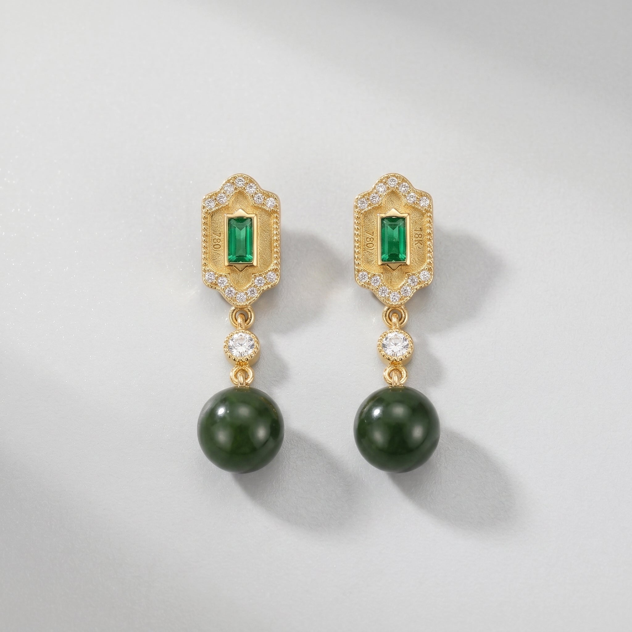 Kindred Green Jade and Emerald Drop Earrings featuring 18K gold, emerald gemstones, and jade beads.