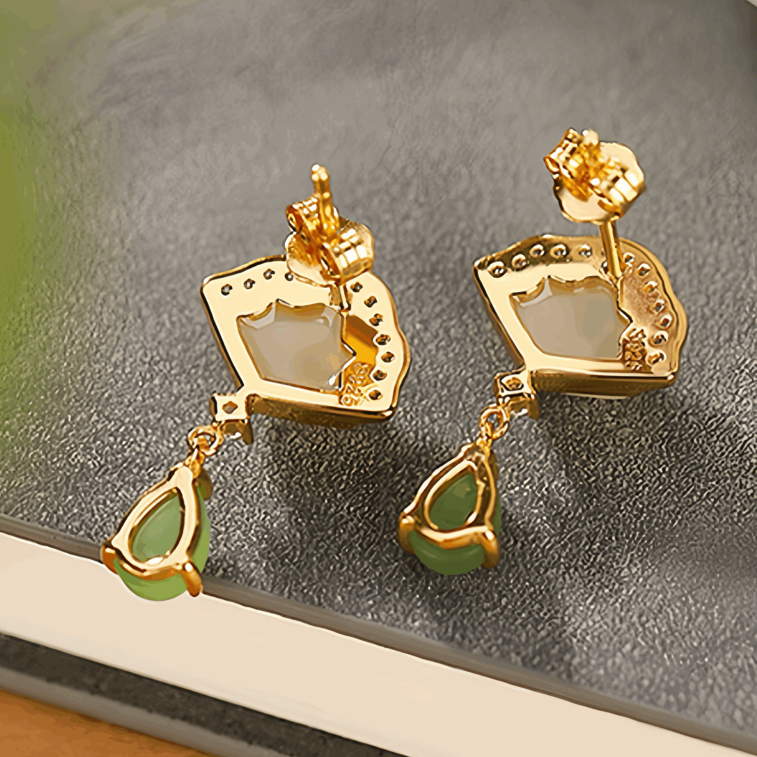 Slow Dance Hetian Jade water drop earrings with gold-plated silver details.