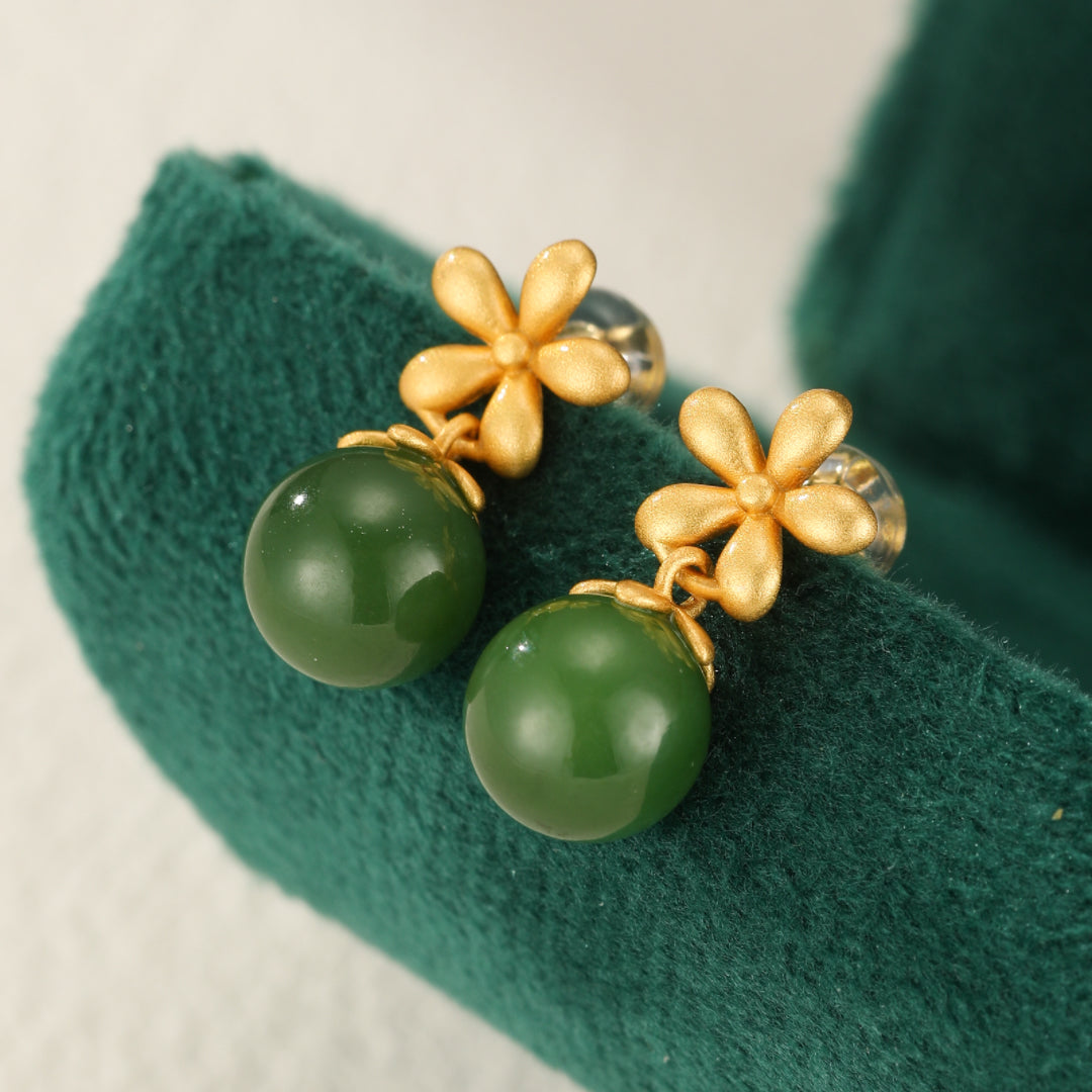 Sweet Nothings gold plated silver earrings featuring green Hetian jade flower drops.