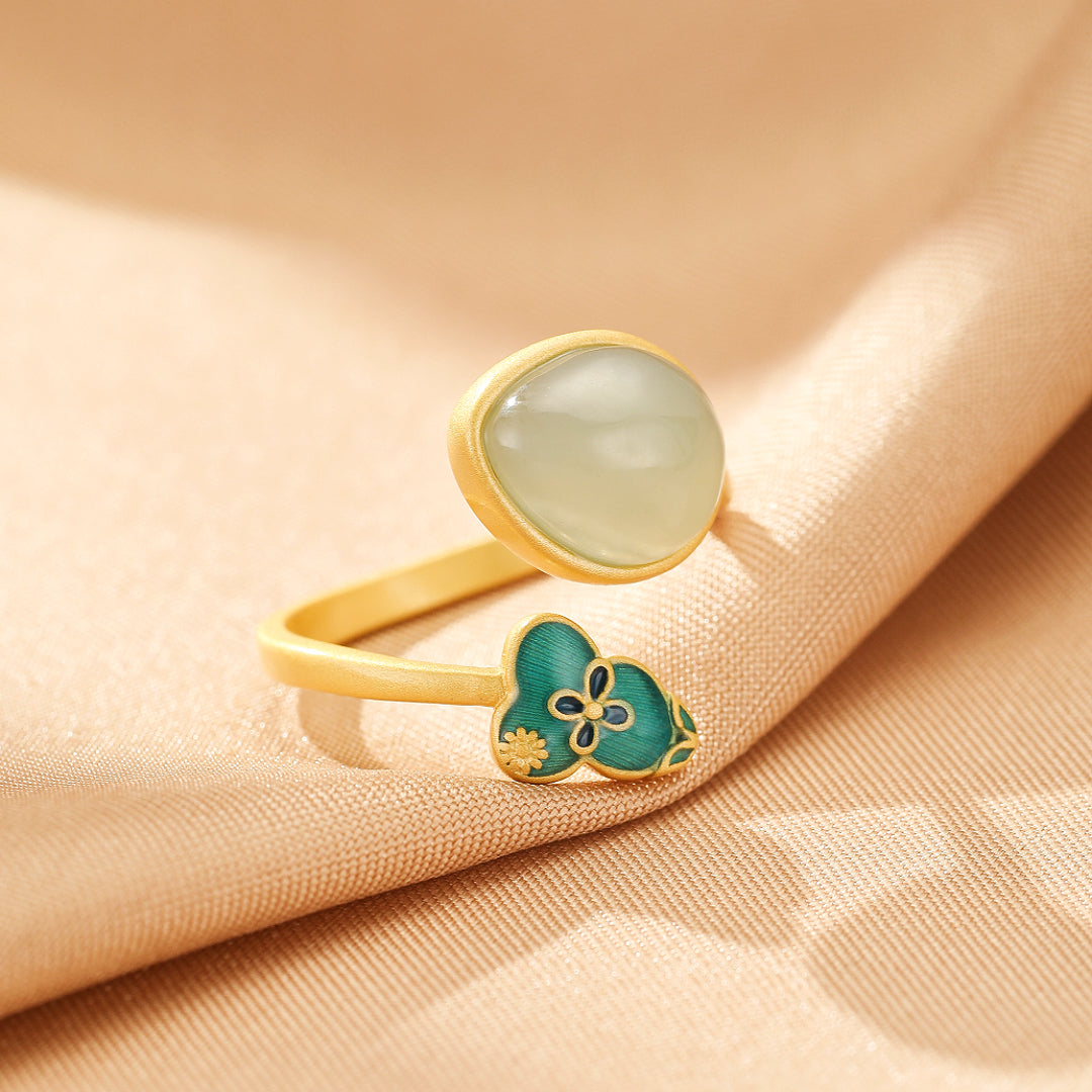 Twice Blessed Hetian Jade Gourd Jewelry Set: A gold-plated silver ring featuring a smooth, translucent Hetian jade stone and a decorative gourd-shaped accent with green enamel and floral details.